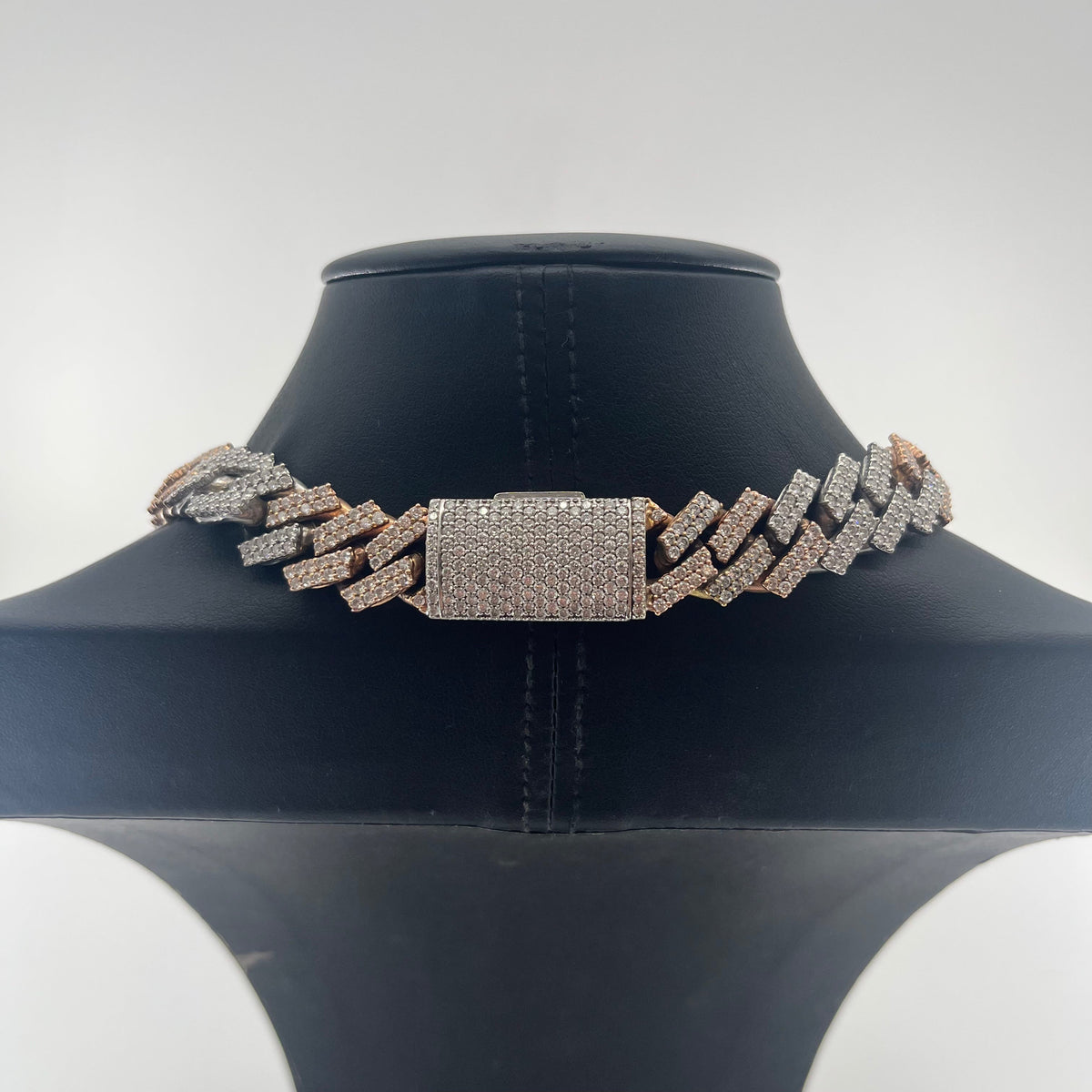 CB STORES 14ct diamond prong Cuban chain displayed on a black jewellery stand with a plain white background.