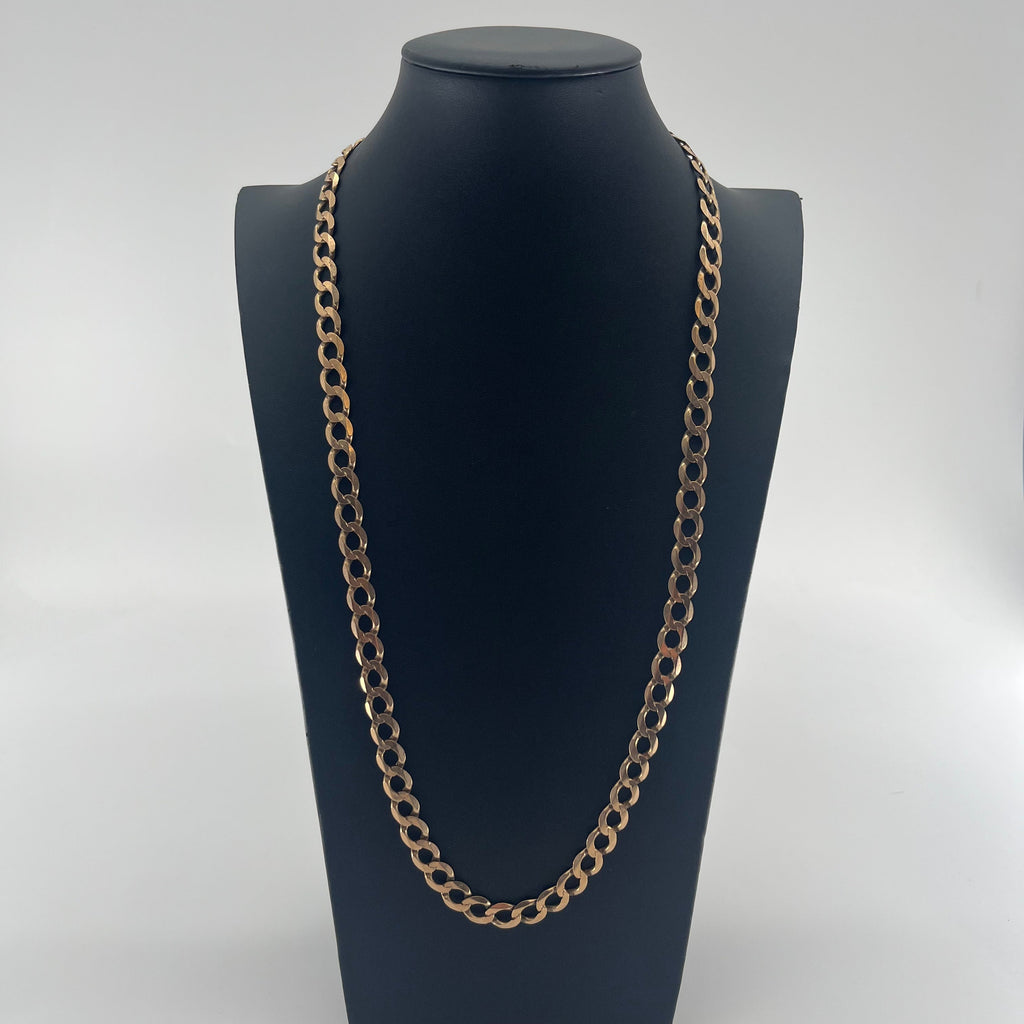CB STORES yellow gold flat curb chain displayed on a black bust with a white background.