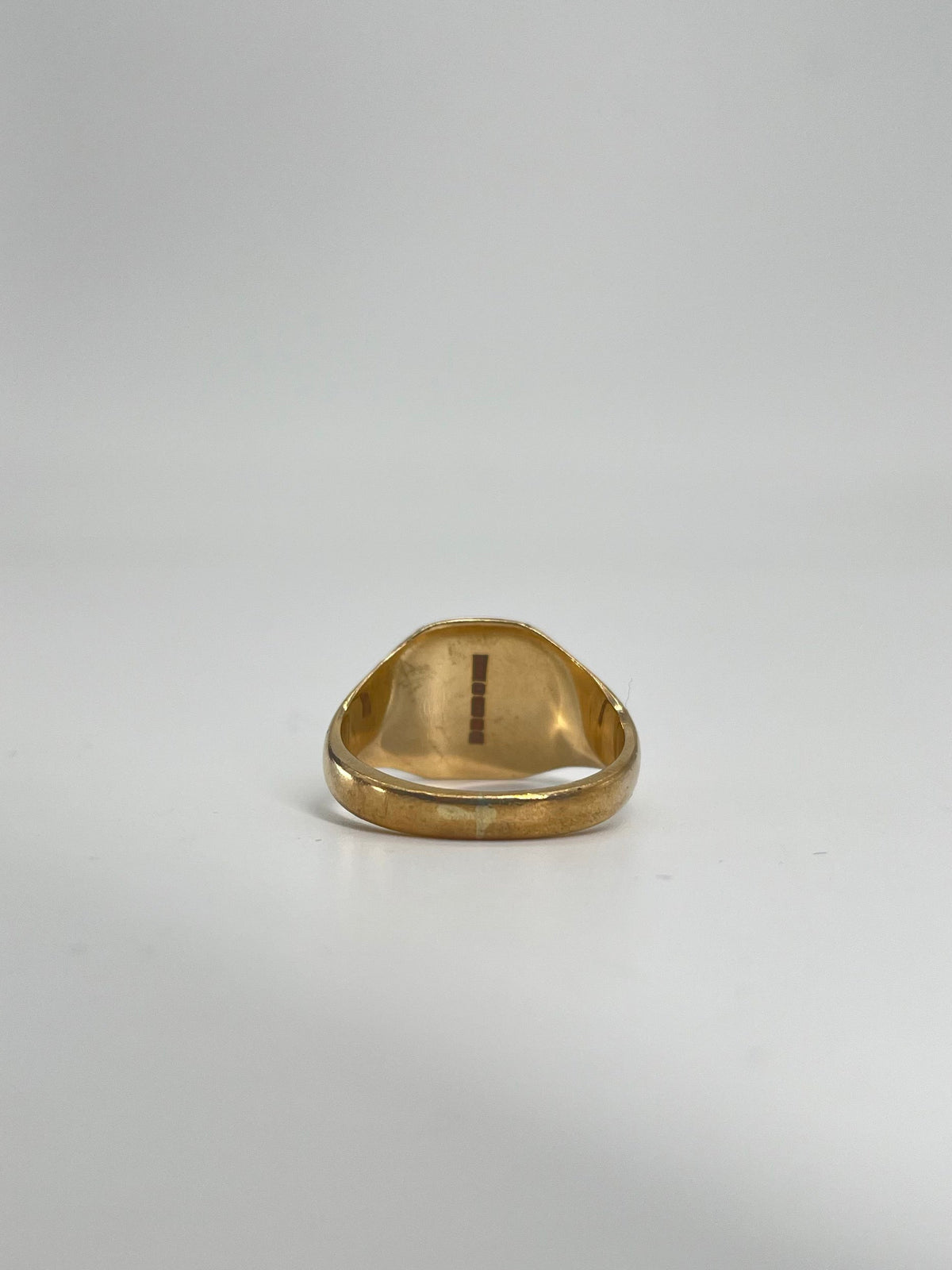 CB STORES 9ct gold square signet ring shown from a low angle on a white background, highlighting the polished inner band.