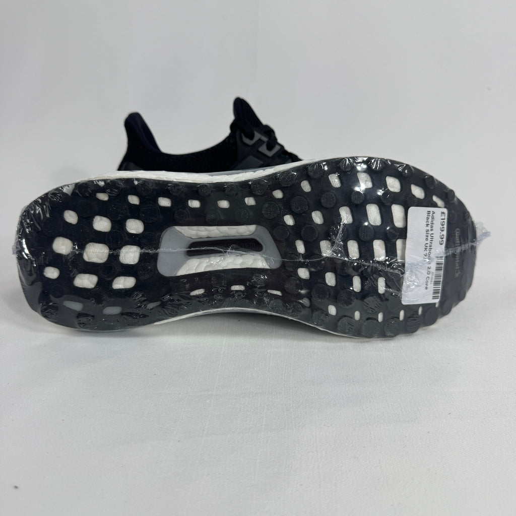 The Adidas Ultraboost 2.0 Core Black White is a running-inspired sneaker featuring a breathable Primeknit upper, responsive