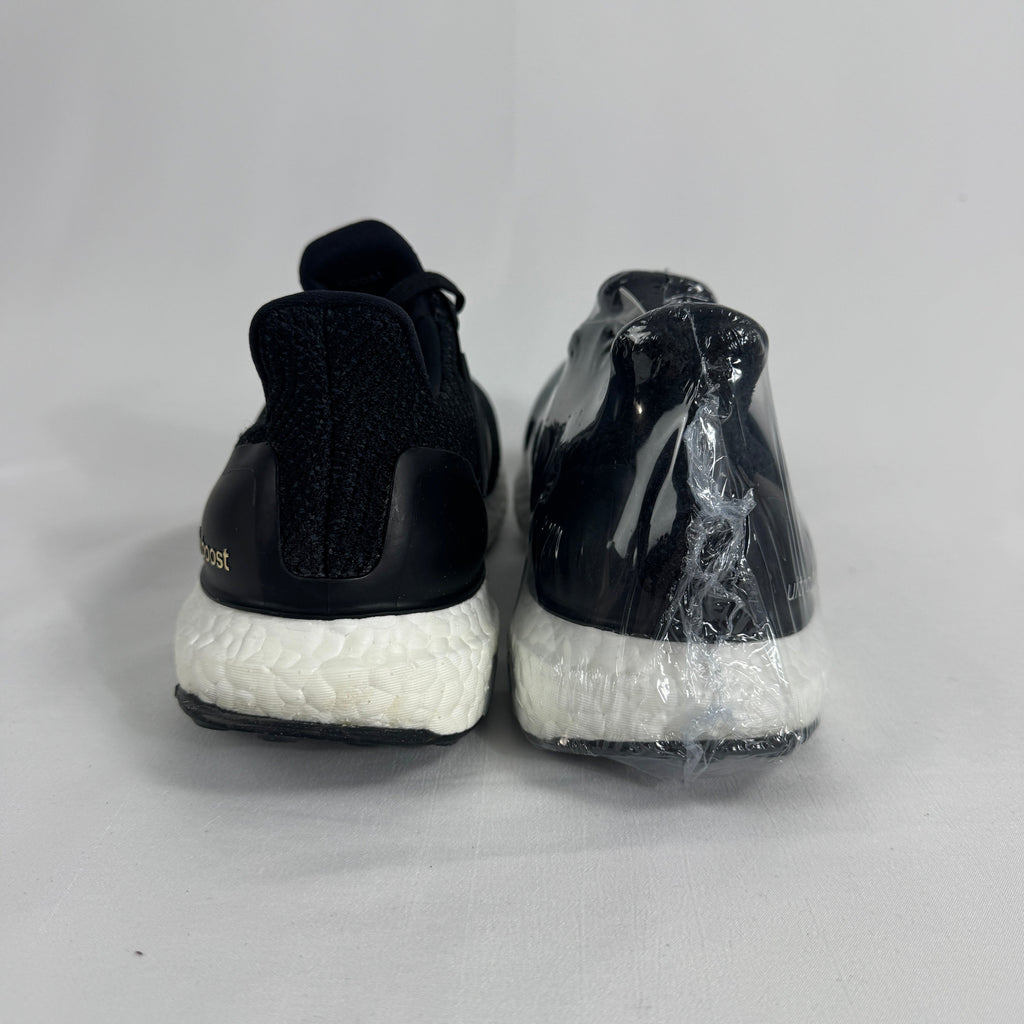 The Adidas Ultraboost 2.0 Core Black White is a running-inspired sneaker featuring a breathable Primeknit upper, responsive