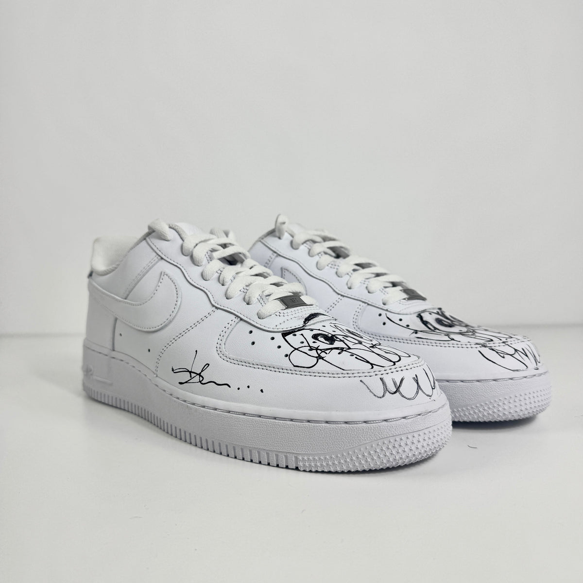 Air Force 1 (Signed by Olaoluslawn) combines the timeless Air Force 1 silhouette with a unique personal touch through