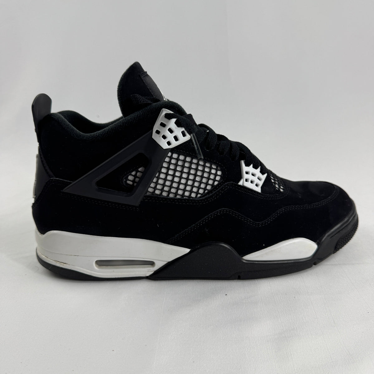 Air Jordan 4 Retro Black/White is a clean, classic version of the Jordan 4 with a black and white leather upper, mesh side