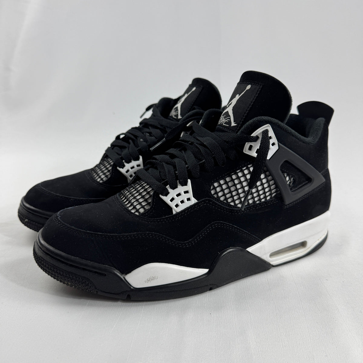 Air Jordan 4 Retro Black/White is a clean, classic version of the Jordan 4 with a black and white leather upper, mesh side