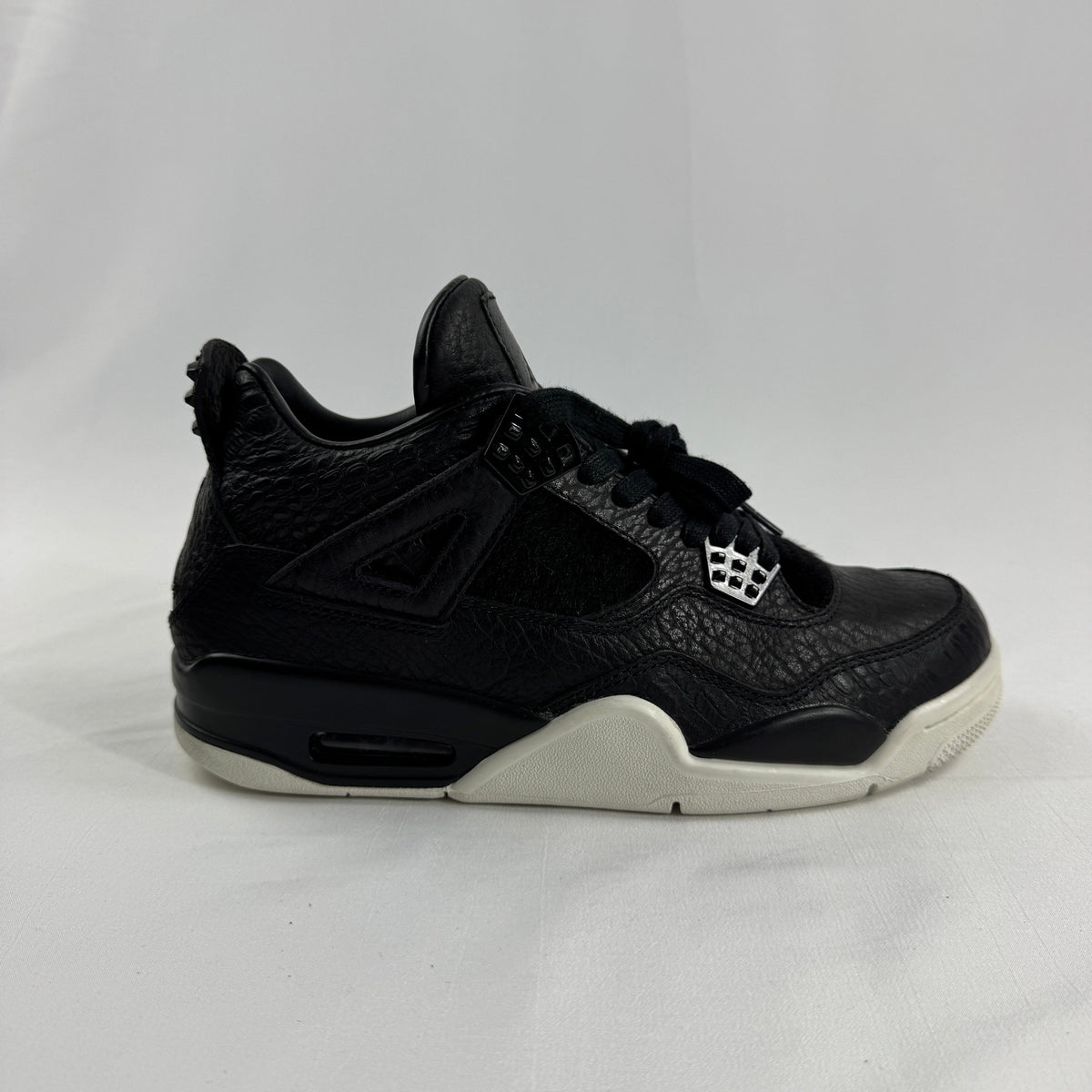 The Air Jordan 4 Retro Premium is a luxury reinterpretation of the classic Air Jordan 4 silhouette, focusing on high-end