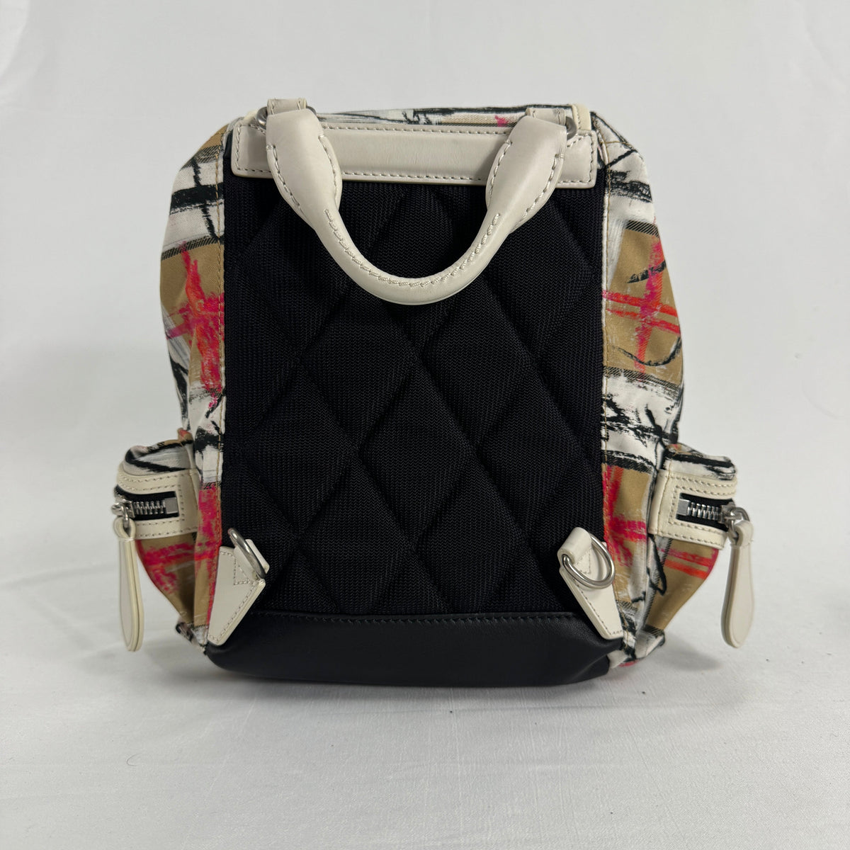 The Burberry Multi Canvas Backpack is a luxury backpack made from durable canvas with Burberry’s signature patterns and