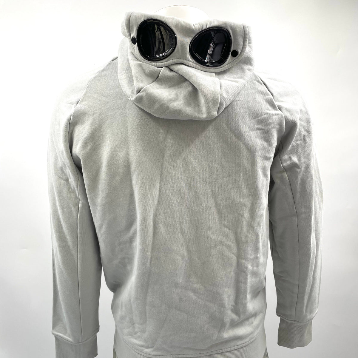 CP Company Hooded Zipup Grey crafted from premium fabric, featuring a full zip closure, adjustable hood, signature C.P.