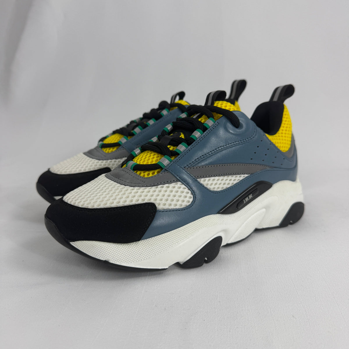 The Dior B22 Blue/Beige is a luxury chunky sneaker that blends retro running-inspired design with modern high-fashion style.