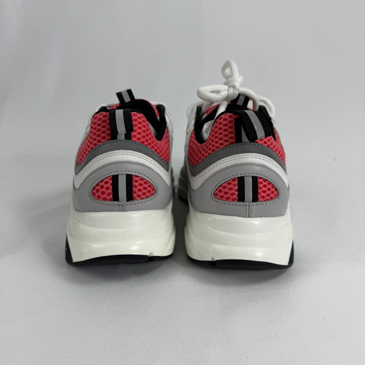 The Dior B22 White/Pink is a luxury sneaker that blends a chunky, retro-inspired silhouette with modern fashion appeal.