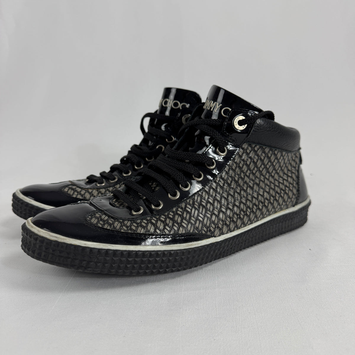 The Jimmy Choo Belgravia High-Top is a luxury sneaker that combines contemporary streetwear style with premium