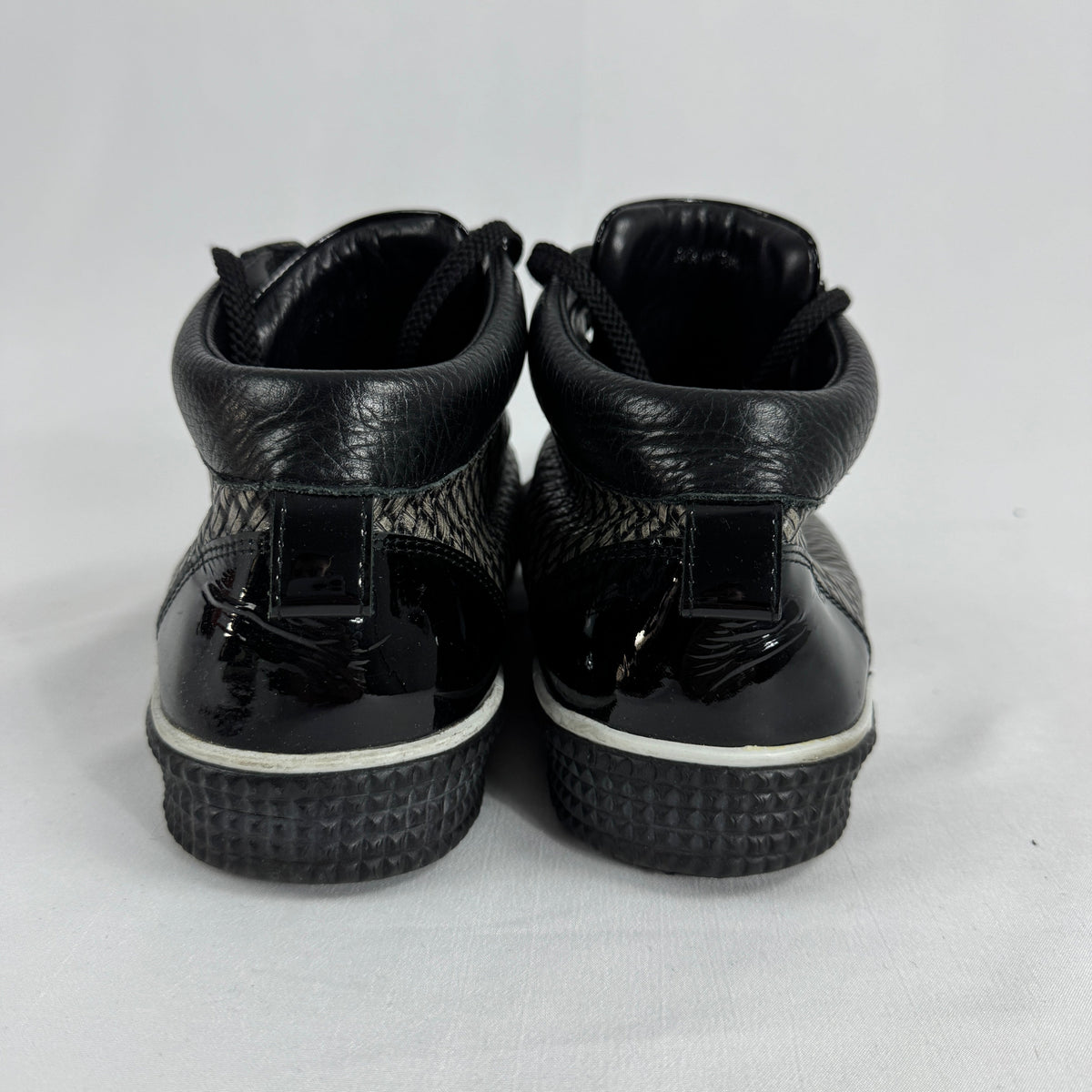 The Jimmy Choo Belgravia High-Top is a luxury sneaker that combines contemporary streetwear style with premium