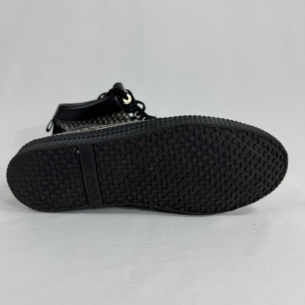 The Jimmy Choo Belgravia High-Top is a luxury sneaker that combines contemporary streetwear style with premium