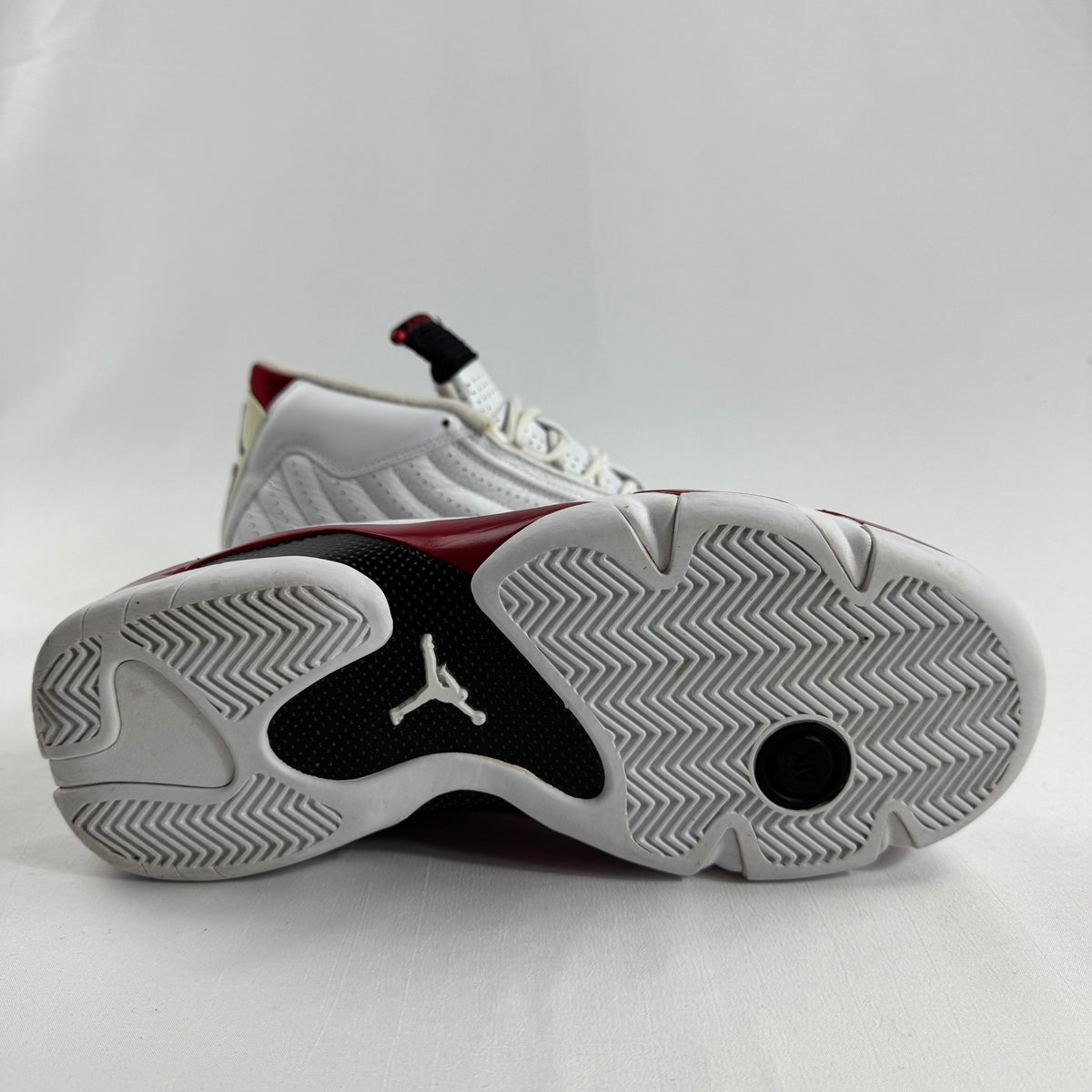 The Jordan 14 Retro "Candy Cane" (2012) is a classic re-release of one of the most recognizable Air Jordan 14 colorways.