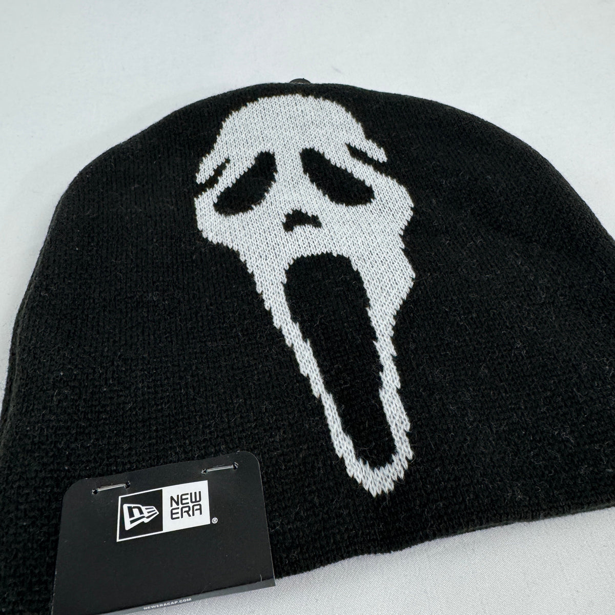 Supreme x New Era black Ghostface beanie featuring a bold front Ghostface graphic and embroidered Supreme logo to the