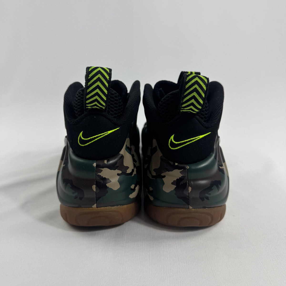 Nike Air Foamposite Pro Army Camo is a bold military-inspired take on the iconic Foamposite Pro silhouette. Featuring a