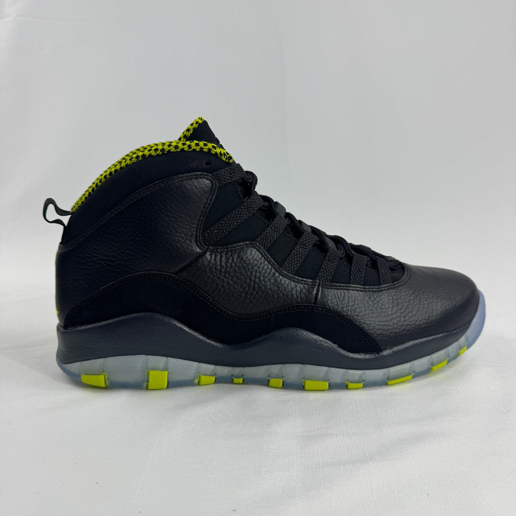 The Nike Air Jordan 10 Retro Black Venom features a sleek black tumbled leather upper paired with vibrant Venom Green