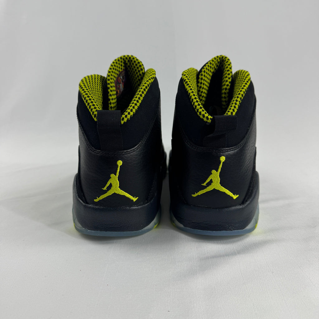 The Nike Air Jordan 10 Retro Black Venom features a sleek black tumbled leather upper paired with vibrant Venom Green