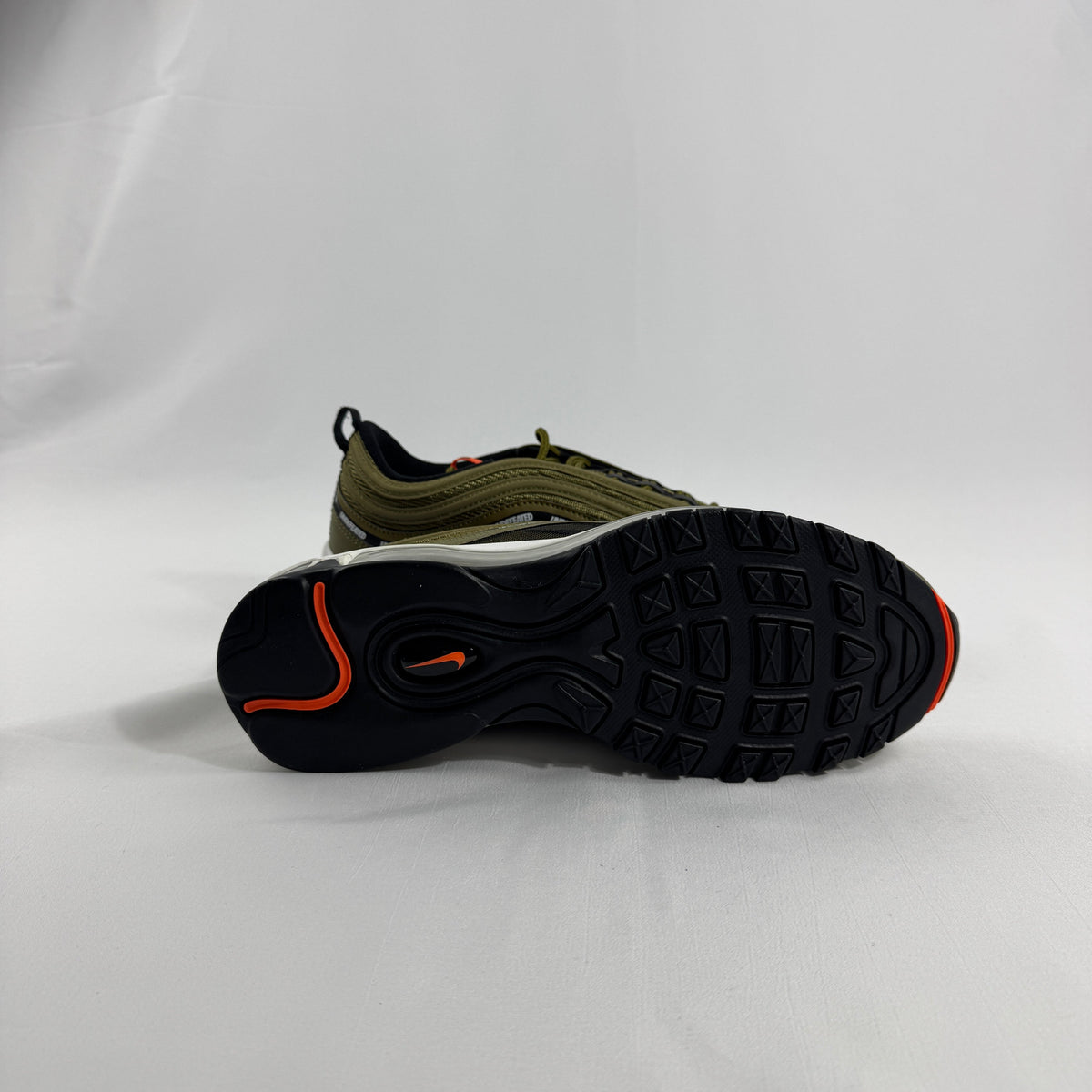 Nike Air Max 97 OG / UNDEFEATED is a premium collaboration that reimagines the iconic Air Max 97 through Undefeated’s bold