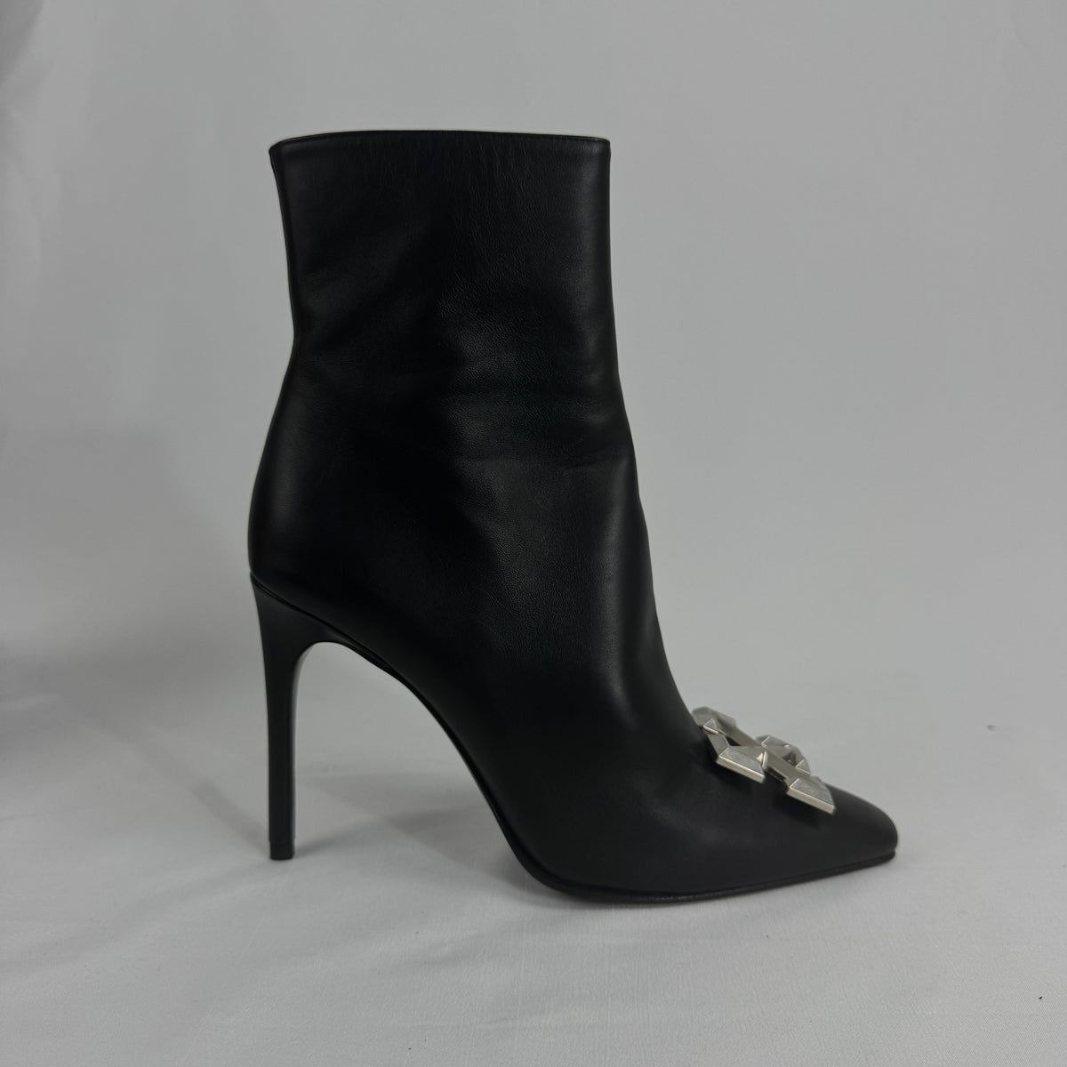 The Off-White Arrow Heels reinterpret classic high-heel design through the brand’s signature streetwear lens. Crafted from