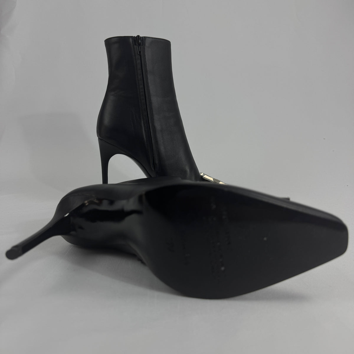 The Off-White Arrow Heels reinterpret classic high-heel design through the brand’s signature streetwear lens. Crafted from