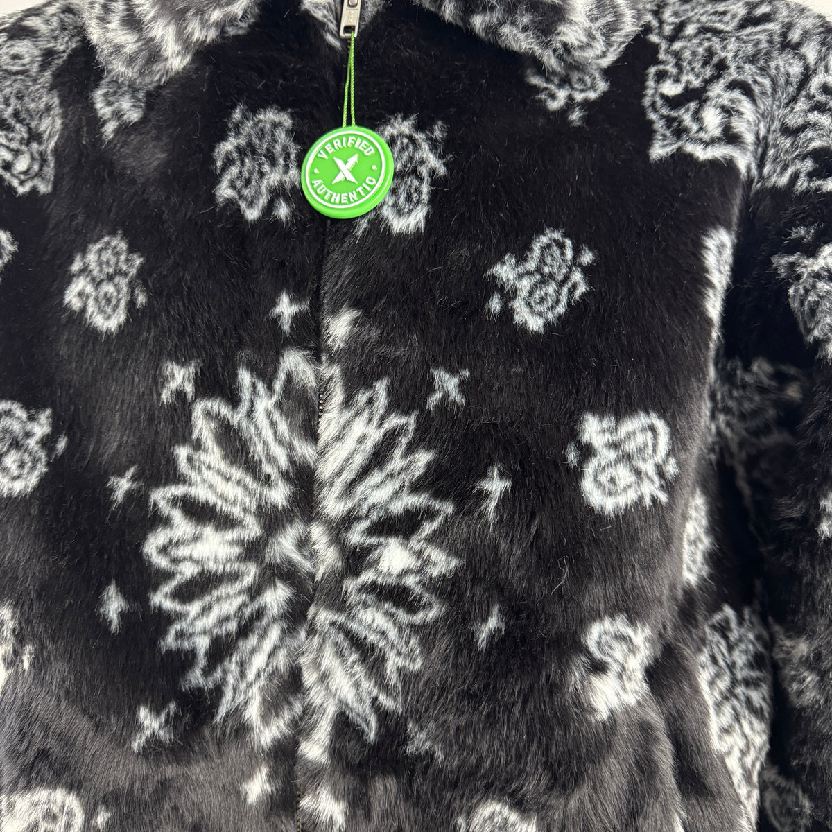 The Supreme Faux Fur Zip-Up Jacket is a heavyweight streetwear piece made with a faux fur outer shell and a full zip front.