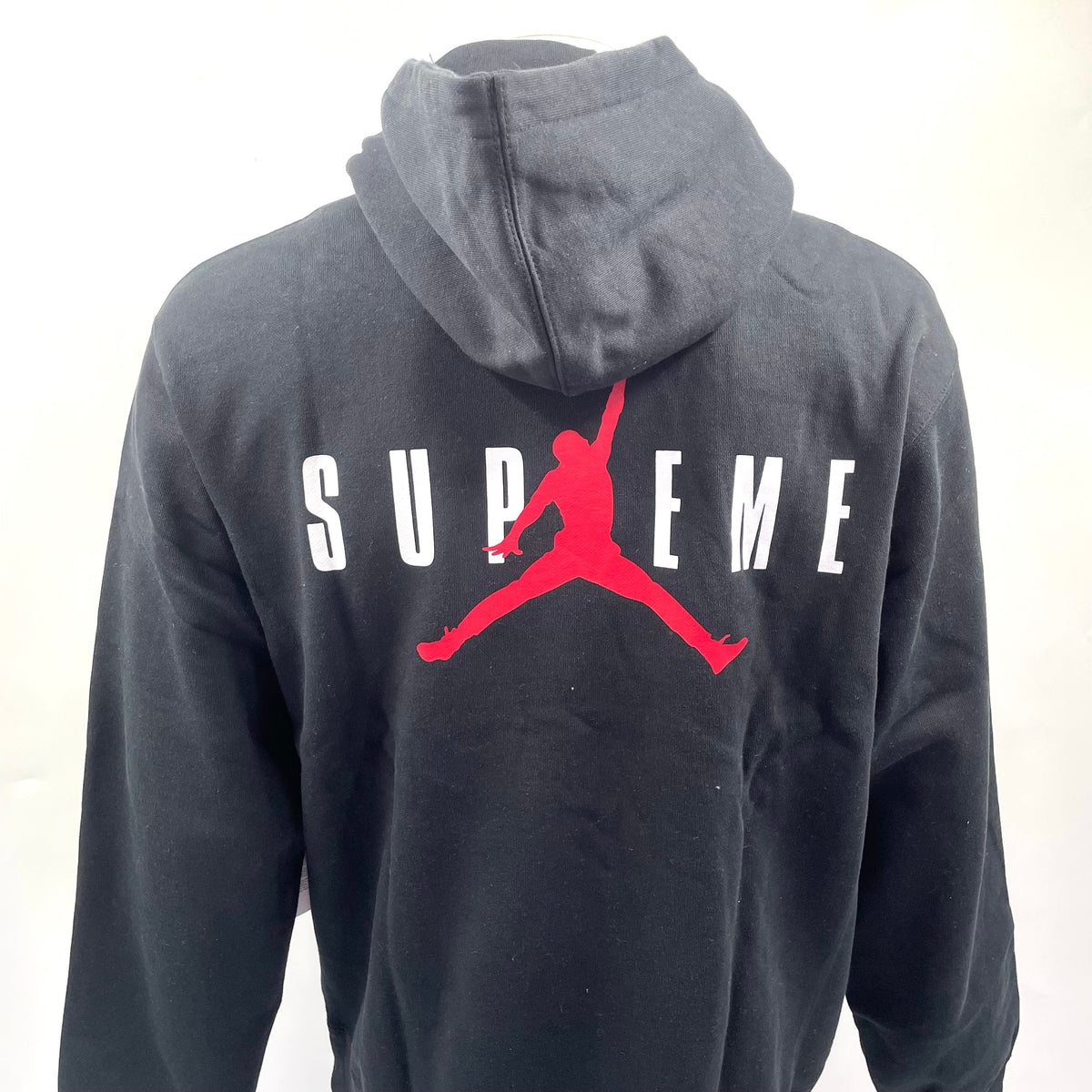 A standout Supreme x Jordan black hoodie with embroidered front branding, bold rear Jumpman logo, drawstring hood and