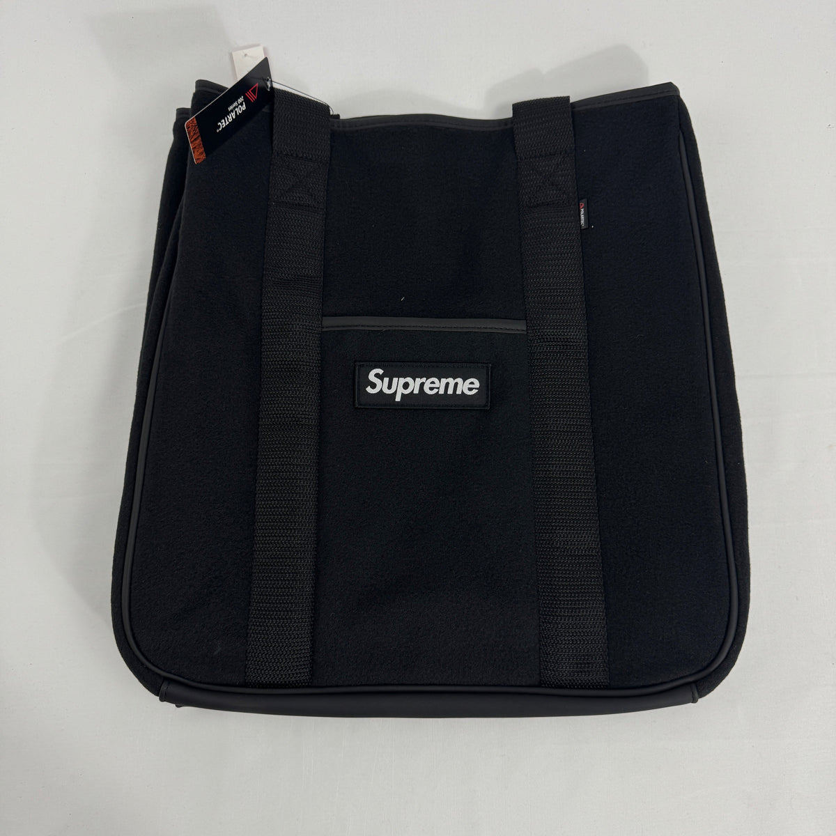 The Supreme x Polartec Tote Bag is a versatile carryall made from soft, durable Polartec fleece for a distinctive textured