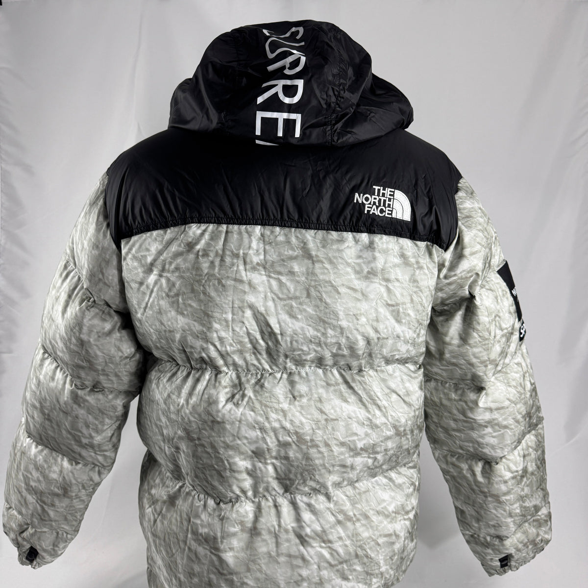 The Supreme x The North Face Nuptse is a collaborative version of The North Face’s iconic down jacket, combining the classic