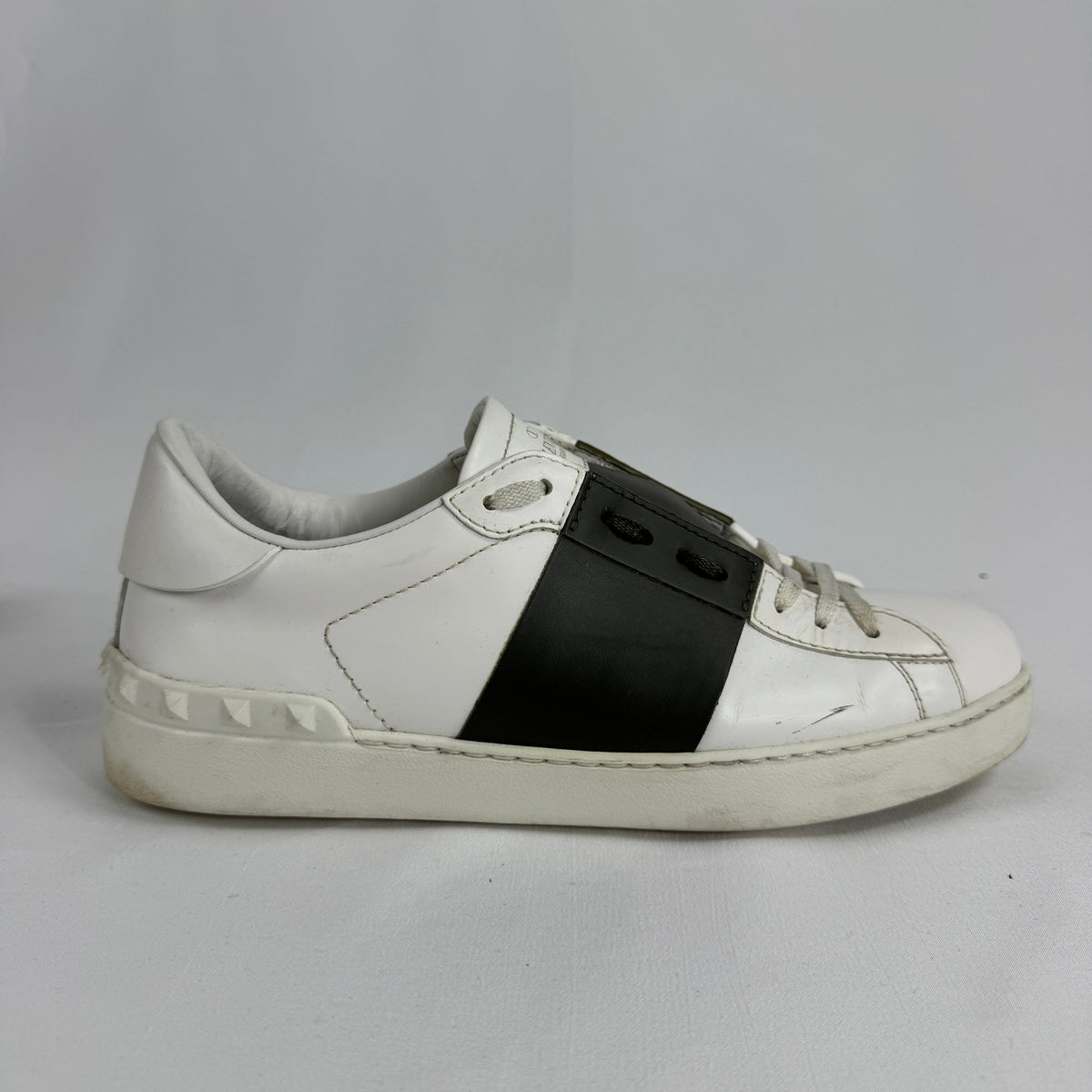 The Valentino Garavani Open Trainers are a refined luxury sneaker known for their clean, minimalist design and premium