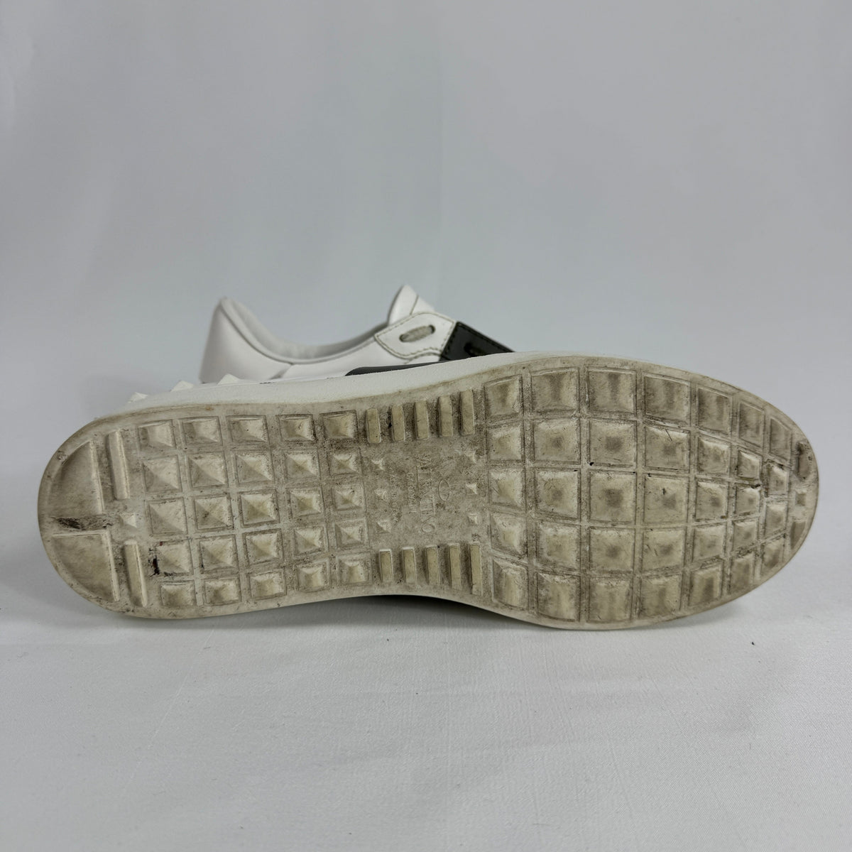 The Valentino Garavani Open Trainers are a refined luxury sneaker known for their clean, minimalist design and premium